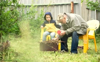 Stock Video Grandfather Preparing A Campfire For PC