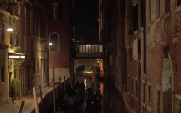 Stock Video Gondolier Heading Down A River At Night For PC
