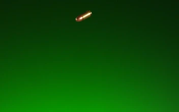 Stock Video Golden Falling Bullets With Green Background For PC
