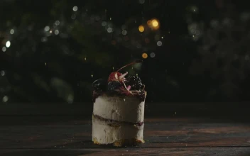 Stock Video Golden Confetti Falling On A Cake For PC