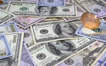 Stock Video Golden Bitcoin Rotating Over Dollar Bills For PC