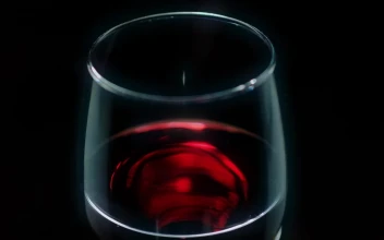 Stock Video Glass With Red Wine On A Black Background For PC