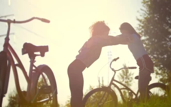 Stock Video Girls Stretching After A Bike Ride Outdoors For PC
