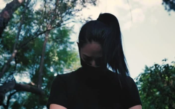 Stock Video Girl With Mask Warming Up And Stretching In Nature For PC