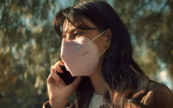 Stock Video Girl With Face Mask Talking On The Cellphone For PC