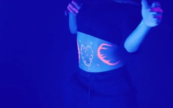 Stock Video Girl With A Mask With Lights Dancing Under Party Lights For PC