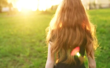 Stock Video Girl Walking Outside Looking Backwards For PC