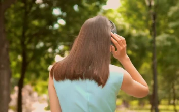 Stock Video Girl Walking In Nature With Music On Her Headphones For PC