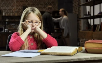 Stock Video Girl Trying To Study While Her Parents Fight For PC