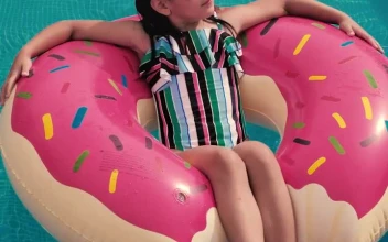 Stock Video Girl Taking The Sun In A Pool For PC