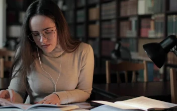 Stock Video Girl Studies High School Education In Library For PC