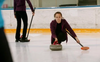 Stock Video Girl Sliding On Ice Playing Curling For PC