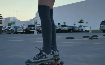 Stock Video Girl Skating Slowly In A Parking Lot For PC