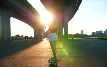 Stock Video Girl Skating In The Afternoon Under A Bridge For PC