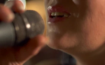 Stock Video Girl Singing Into The Microphone For PC