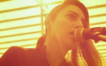 Stock Video Girl Singing Into A Microphone And Playing The Guitar For PC