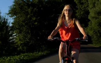 Stock Video Girl Riding A Bike On A Path In Nature For PC