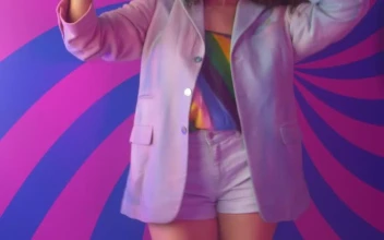 Stock Video Girl Recording Herself Dancing With A Colorful Background For PC