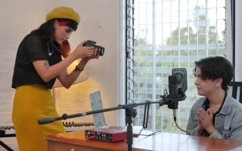 Stock Video Girl Recording A Influencer Sitting At A Desk For PC