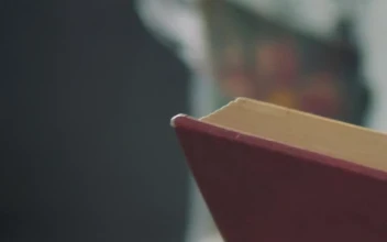 Stock Video Girl Reading A Book In A Shot Close To Her For PC