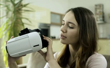 Stock Video Girl Putting On Vr Glasses For PC