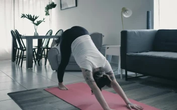 Stock Video Girl Practicing Yoga In A Living Room At Home For PC