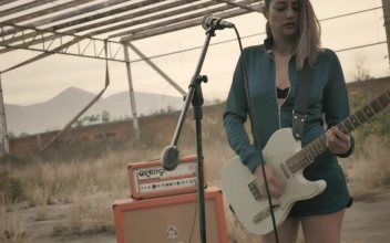 Stock Video Girl Playing Guitar In A Wasteland For PC