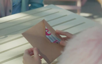 Stock Video Girl Opening An Envelope From A Valentines Day Card For PC