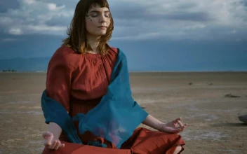 Stock Video Girl Meditating Under The Wind In The Desert For PC