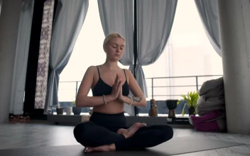 Stock Video Girl Meditating Over A Yoga Mat For PC