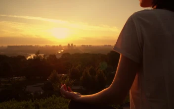 Stock Video Girl Meditating In Yoga Pose At Sunset For PC
