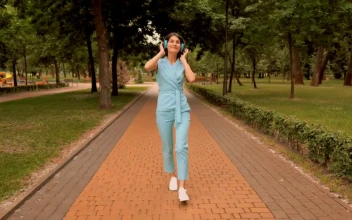 Stock Video Girl Listens To Music And Dances Happily For PC