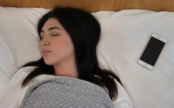 Stock Video Girl Is Awakened By Messages That Arrive On Her Cell For PC
