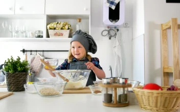 Stock Video Girl In The Kitchen Preparing A Mixture In A Bowl For PC
