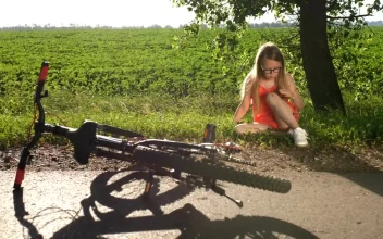 Stock Video Girl Holding Her Leg After A Fall For PC