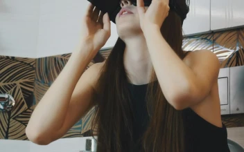 Stock Video Girl Holding A Vr Headset For PC