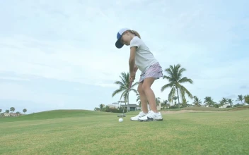 Stock Video Girl Hitting A Golf Ball For PC