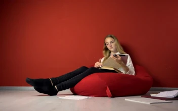 Stock Video Girl Enjoys Distance Learning In Beanbag Chair For PC
