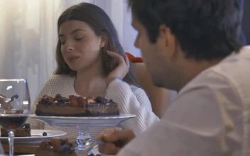 Stock Video Girl Eating At A Christmas Dinner With Friends For PC