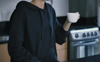Stock Video Girl Drinking A Cup Of Coffee While On A Call For PC