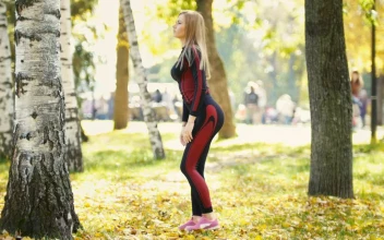 Stock Video Girl Doing Stretching In A Sunny Park For PC