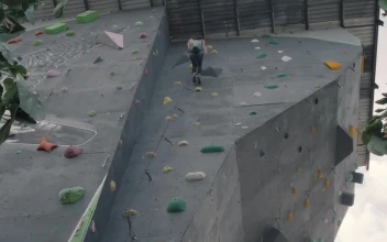 Stock Video Girl Descending From The Top Of A Wall For Mountaineering For PC