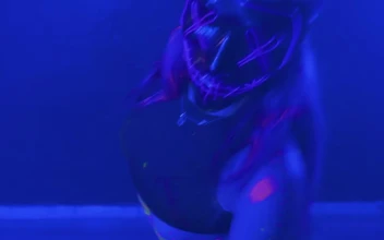 Stock Video Girl Dancing With A Mask Under A Blue Light For PC