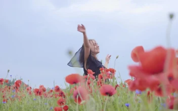 Stock Video Girl Dancing Happily In A Field Of Flowers For PC