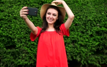 Stock Video Funny Girl Taking Selfies Wearing A Red Dress For PC