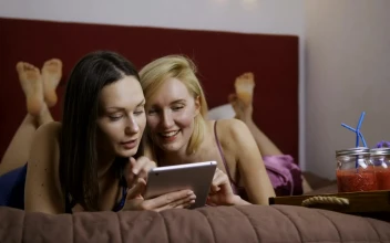Stock Video Funny Friends At Home While Using A Tablet For PC