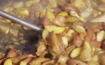Stock Video Frying Potatoes On A Pan For PC