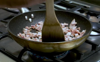 Stock Video Frying Bacon Chunks On The Stove For PC
