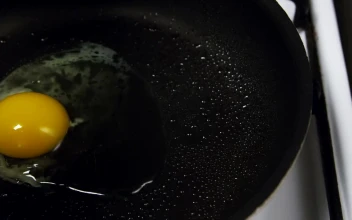 Stock Video Frying An Egg In Hot Oil For PC