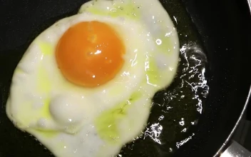 Stock Video Frying A Crashed Egg In A Frying Pan For PC